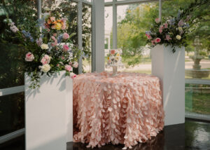 Dreamy pastel floral arrangements with a 2-tiered white strawberries & cream cake, baked by Michelle's Patisserie with decorated with buttercream floral patterns.