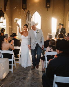 Bride and groom walk down the aisle of their golden hour ceremony at Chapel Dulcinea